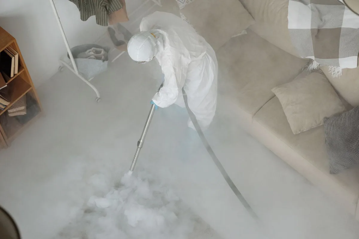 Biohazard cleanup technician in protective equipment, Riverfront, Miami, FL